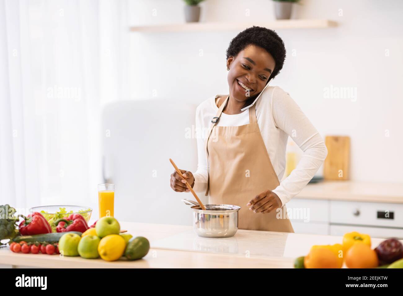 happy-black-housewife-cooking-hi-res-stock-photography-and-images-alamy