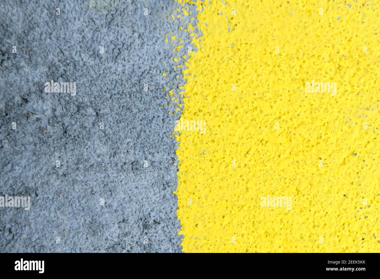 Yellow gray wall background. Abstract concrete textured wall background. Stock Photo