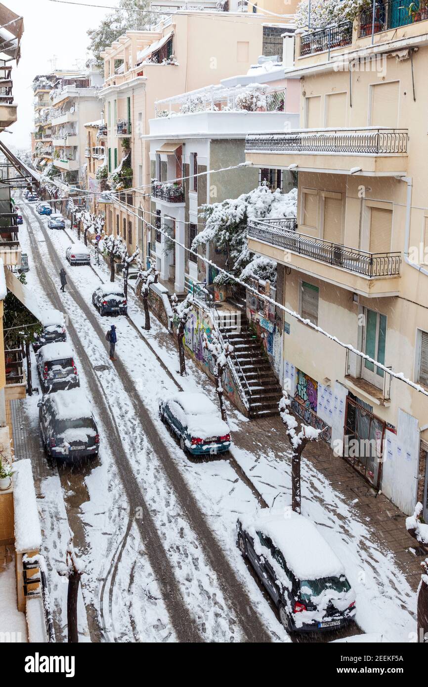 Snowfall in Kallidromiou street, in Eksarchia district, in Athens city, capital of Greece, Europe Stock Photo