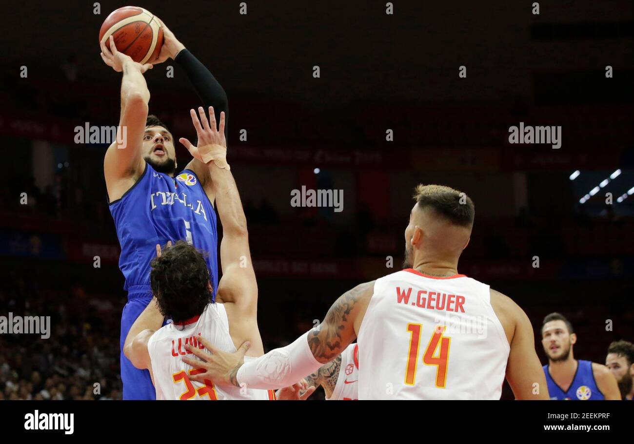 Basketball - FIBA World Cup - Second Round - Group J - Spain v Italy - Wuhan Sports Centre, Wuhan, China - September 6, 2019 Italy's Alessandro Gentile in action with Spain's Sergio Llull and Spain's Willy Hernangomez Geuer REUTERS/Jason Lee Stock Photo