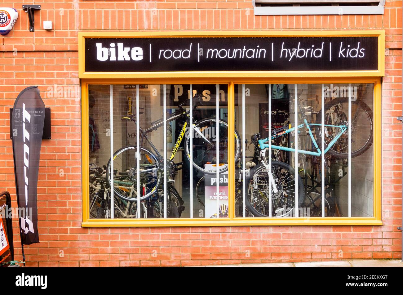 Front window display of bicycles and othe outdoor sports equipment in a retail shop in Devizes calle PUSH Stock Photo
