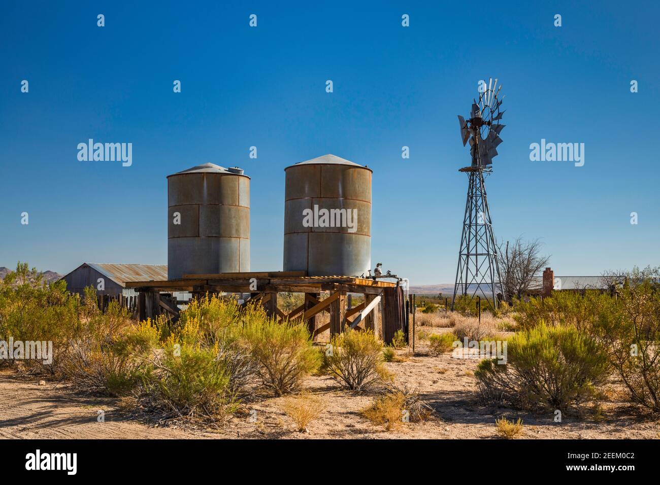 Water tanks, water pump at ranch at Lanfair site, Lanfair Valley, Mojave National Preserve, California, USA Stock Photo