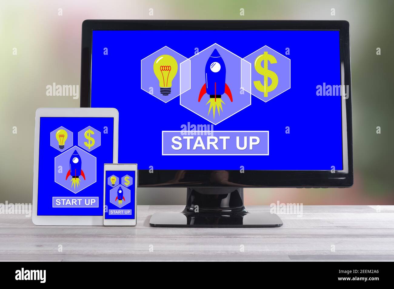 Start up concept shown on different information technology devices Stock Photo