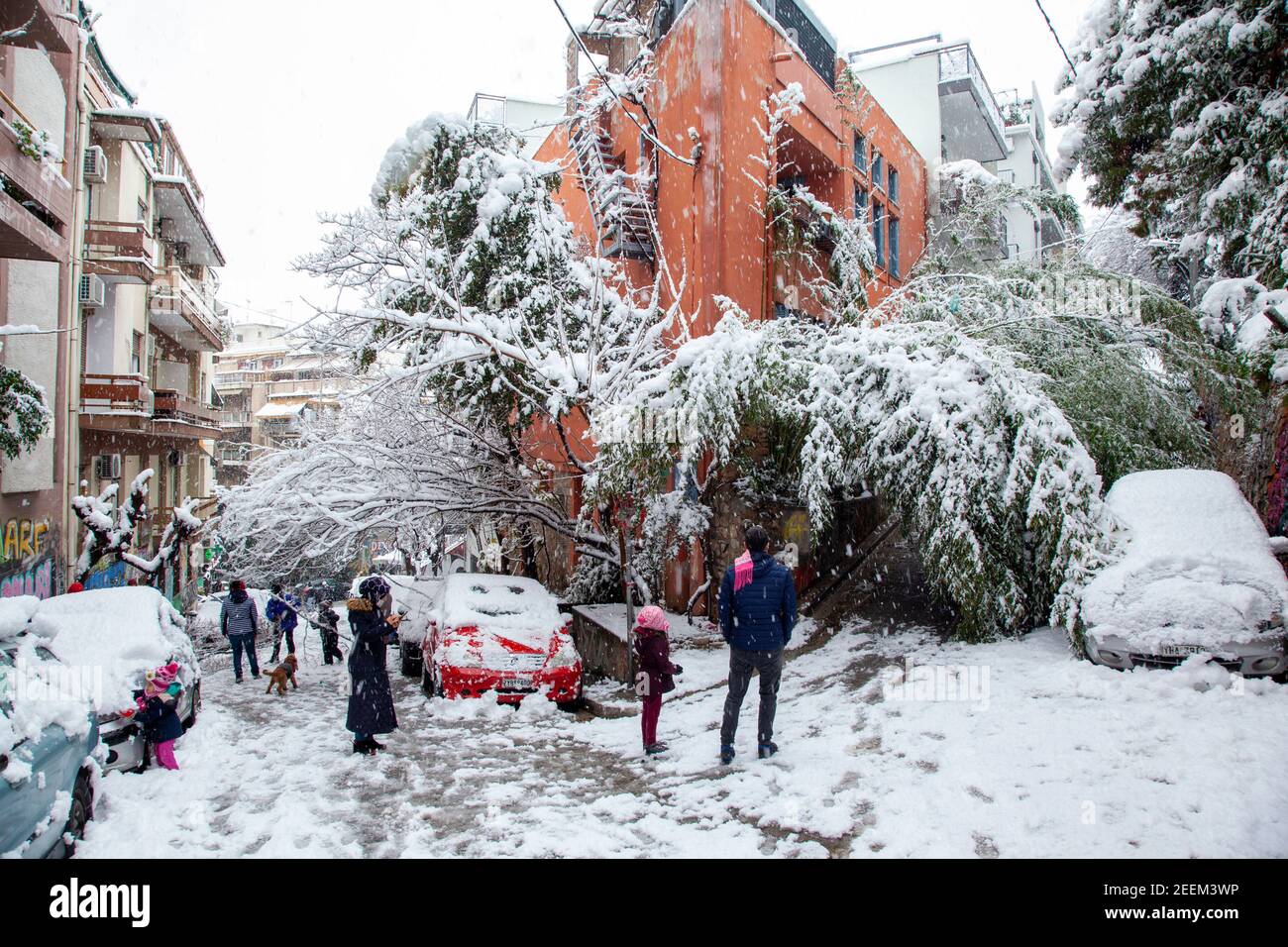 People in Eksarchia district enjoying the snow during a snow storm in Athens city, capital of Greece, Europe Stock Photo