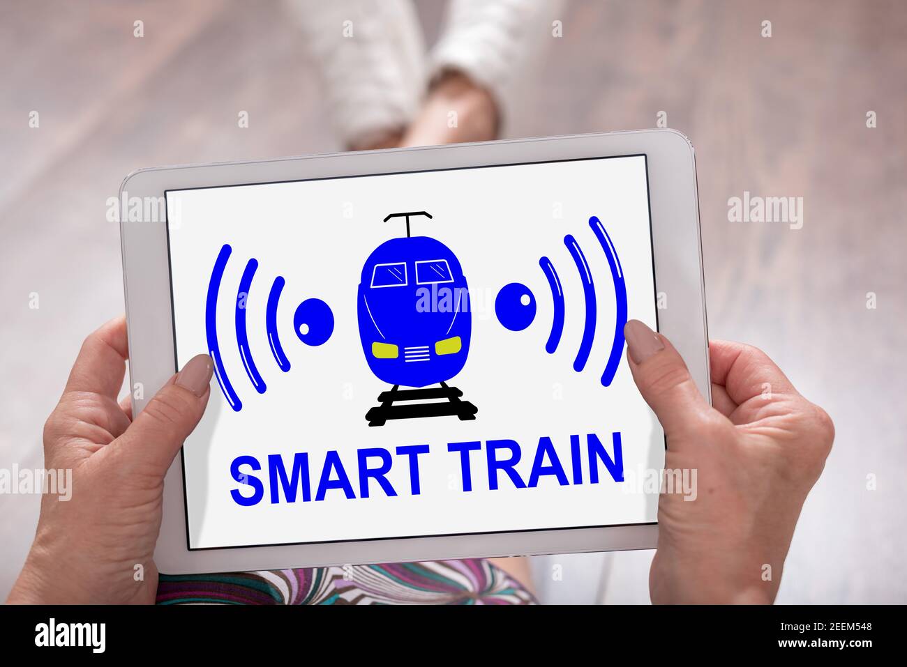 Smart train concept shown on a tablet held by a woman Stock Photo - Alamy