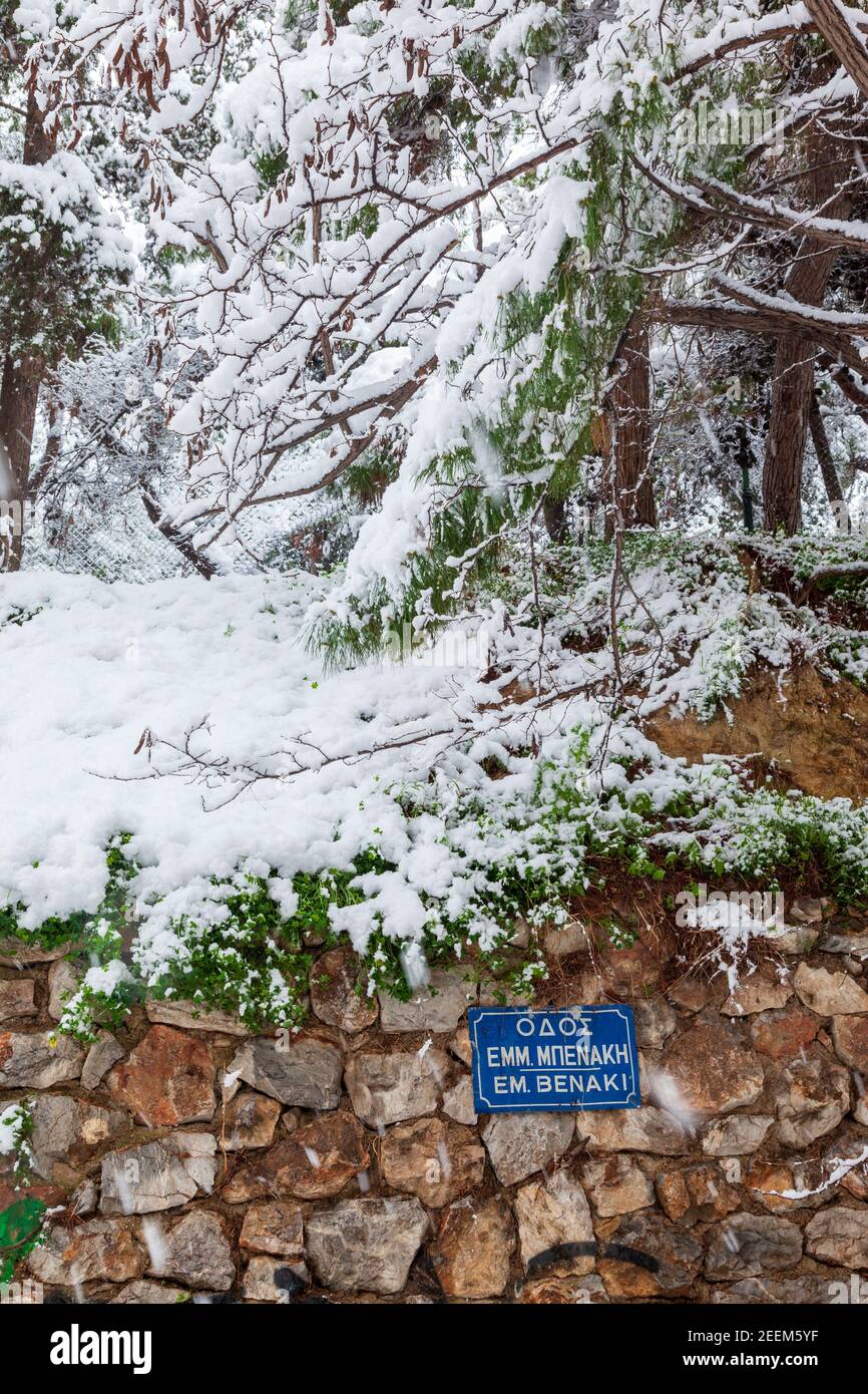 Snowfall in Eksarchia district, in Emmanouil Mpenaki street, downtown Athens city, the capital of Athens, Greece. Stock Photo