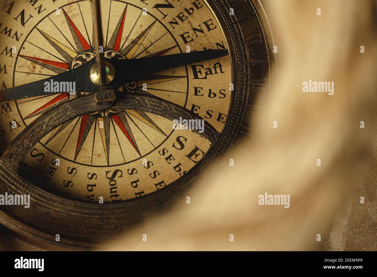Ship rope and compass on wooden background Stock Photo