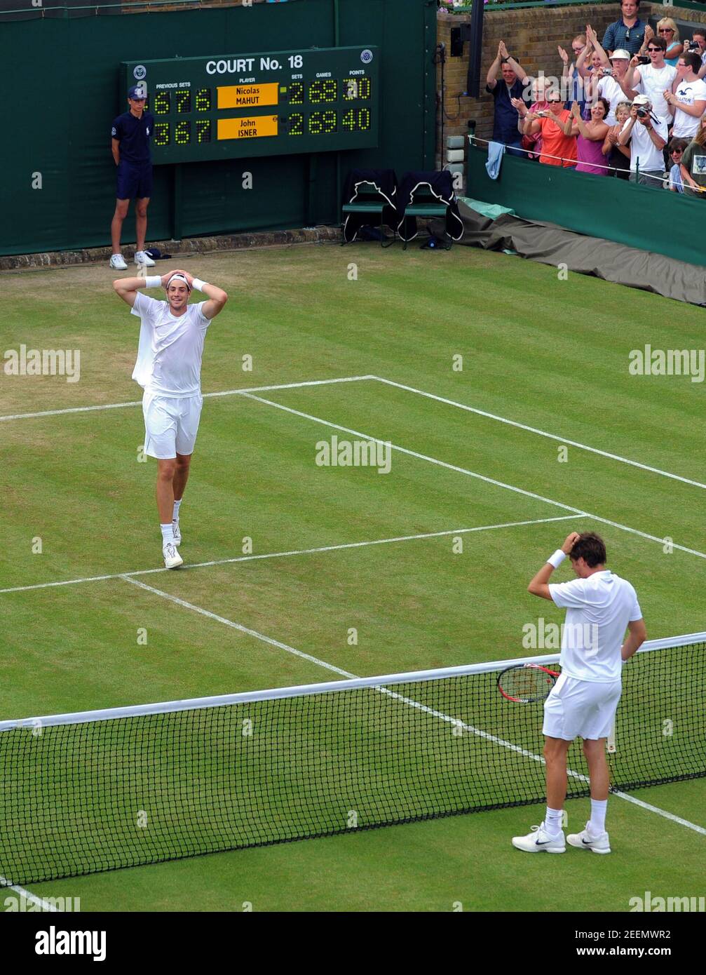 Tennis - Wimbledon - All England Lawn Tennis & Croquet Club, Wimbledon,  England - 24/6/10 John Isner of USA (L) celebrates victory in his first  round match against Nicolas Mahut of France (