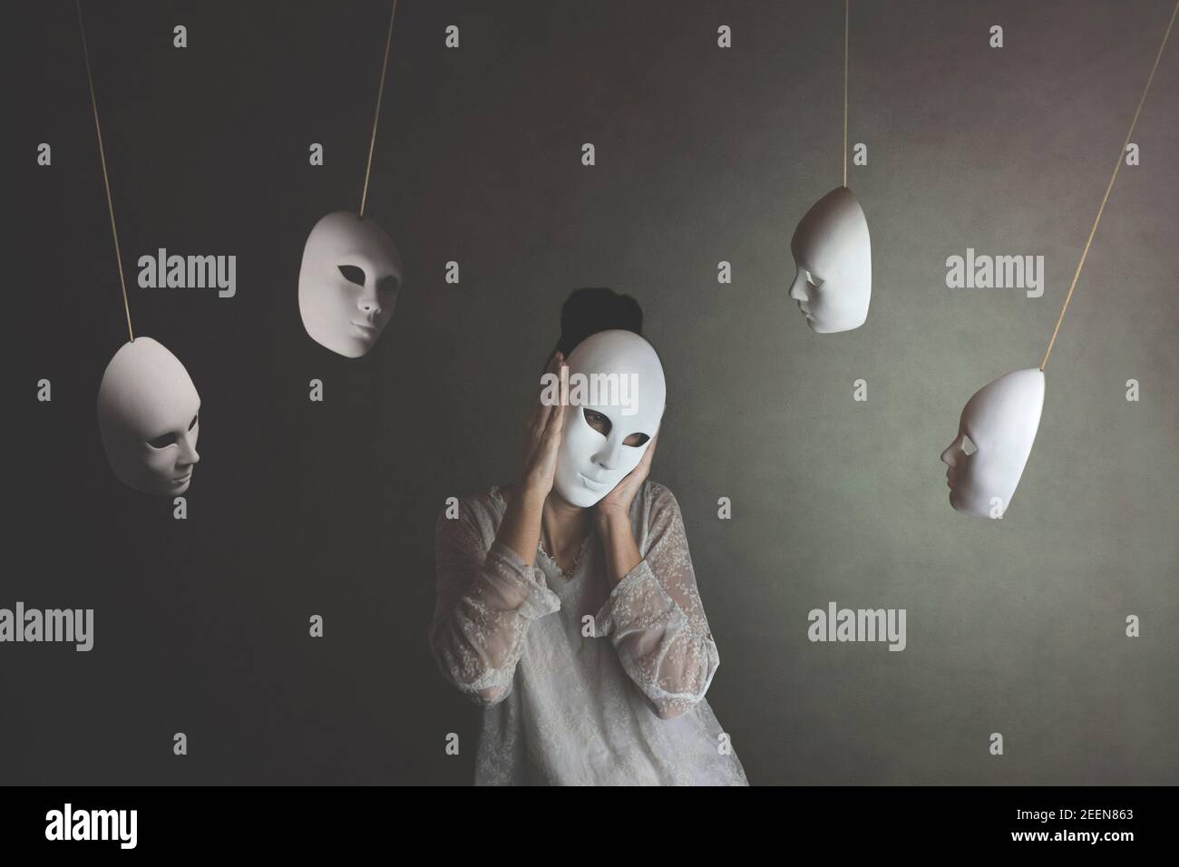 person with mask does not want to hear the judgment of other masks, concept of judgment and introspection Stock Photo
