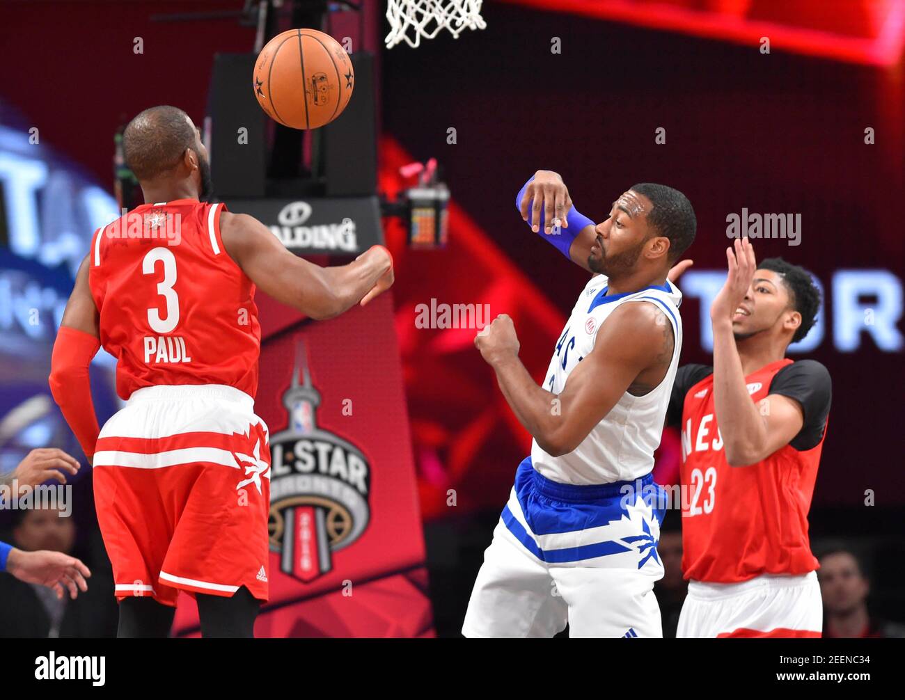 Feb 14, 2016; Toronto, Ontario, CAN; Eastern Conference guard John Wall of  the Washington Wizards (2) passes the ball away from Western Conference  guard Chris Paul of the Los Angeles Clippers (3)