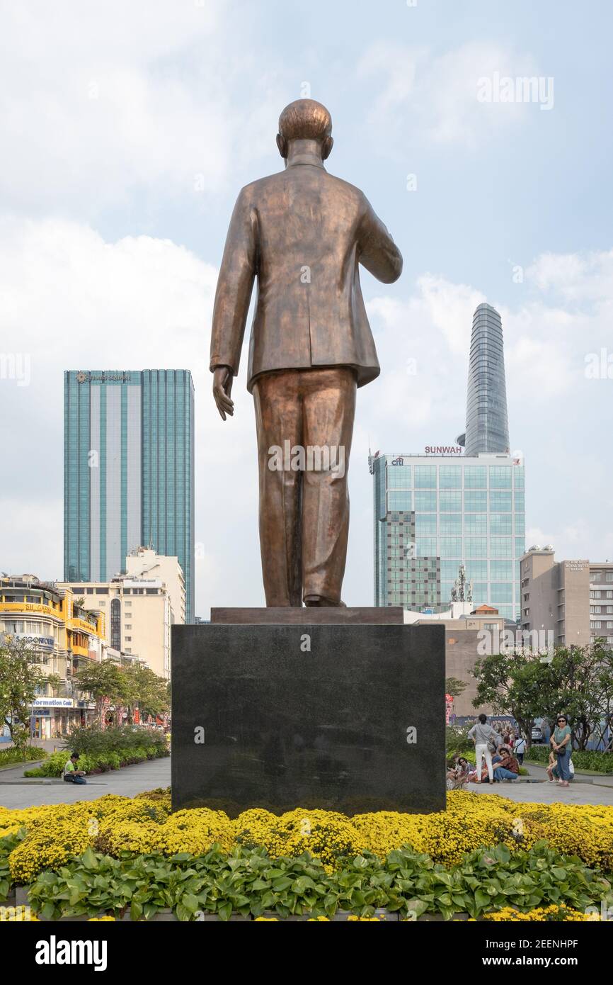 Statue of Ho Chi Minh, view from the back, with the Bitexco Financial Tower in the background Stock Photo