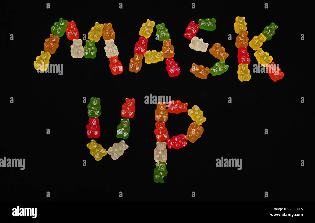 The Words 'MASK UP' spelled out in Gummy Bears Stock Photo