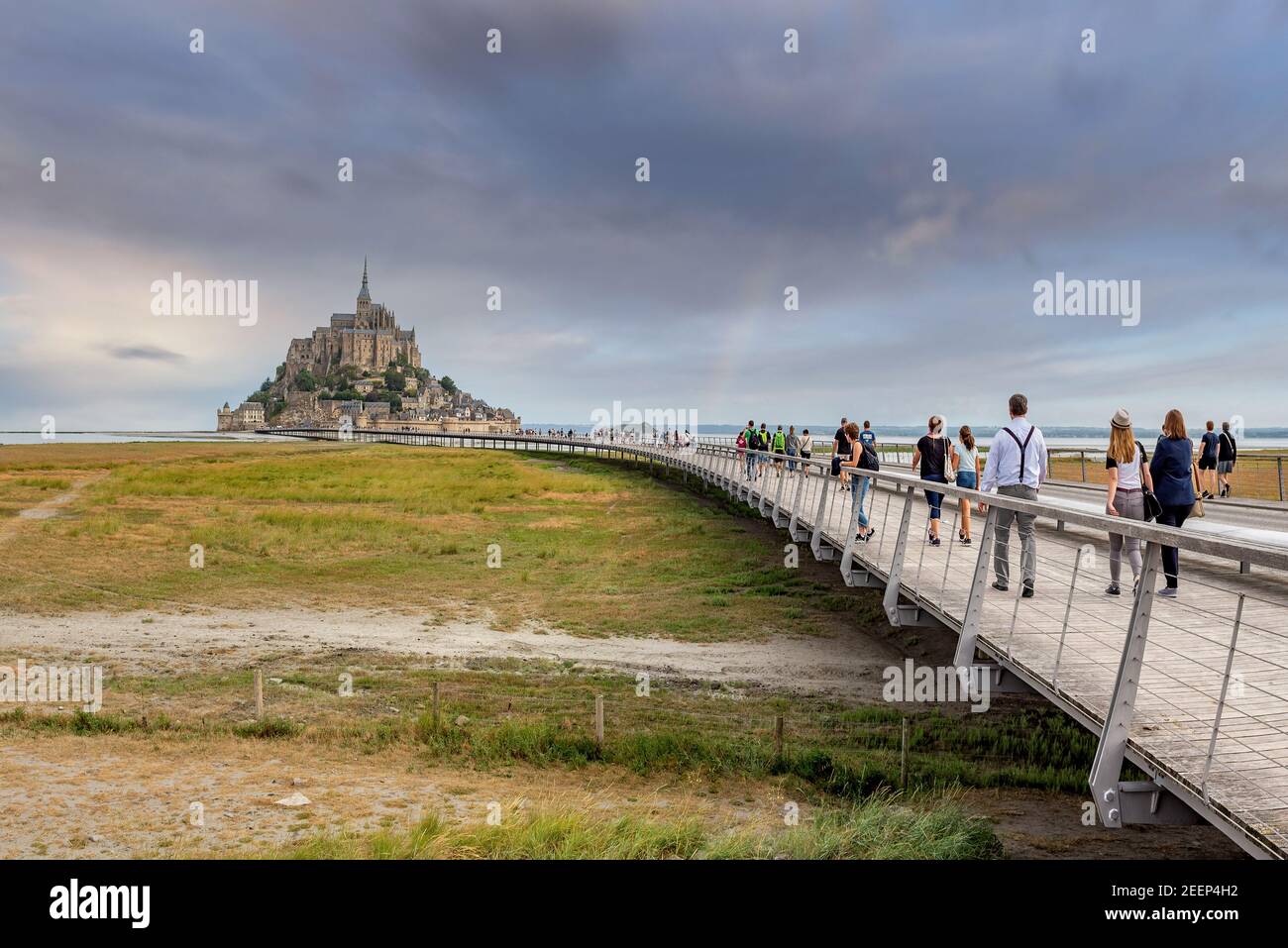 Mont Saint-Michel, France; July 24th 2020 - Vistors walking towards Mont Saint-Michel, Normandy, France Stock Photo