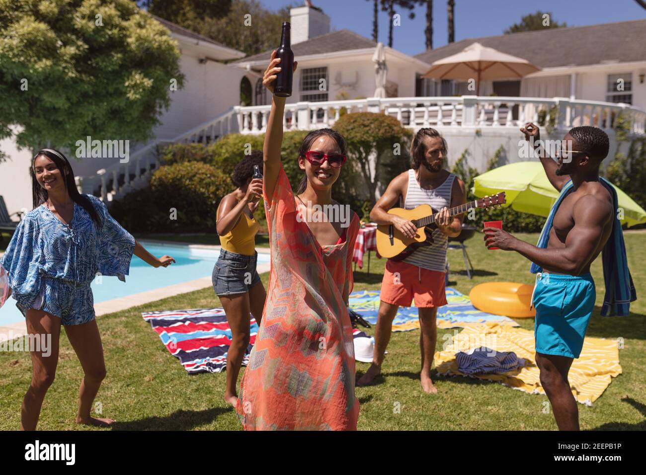 Diverse group of friends having fun at a pool party. hanging out ...