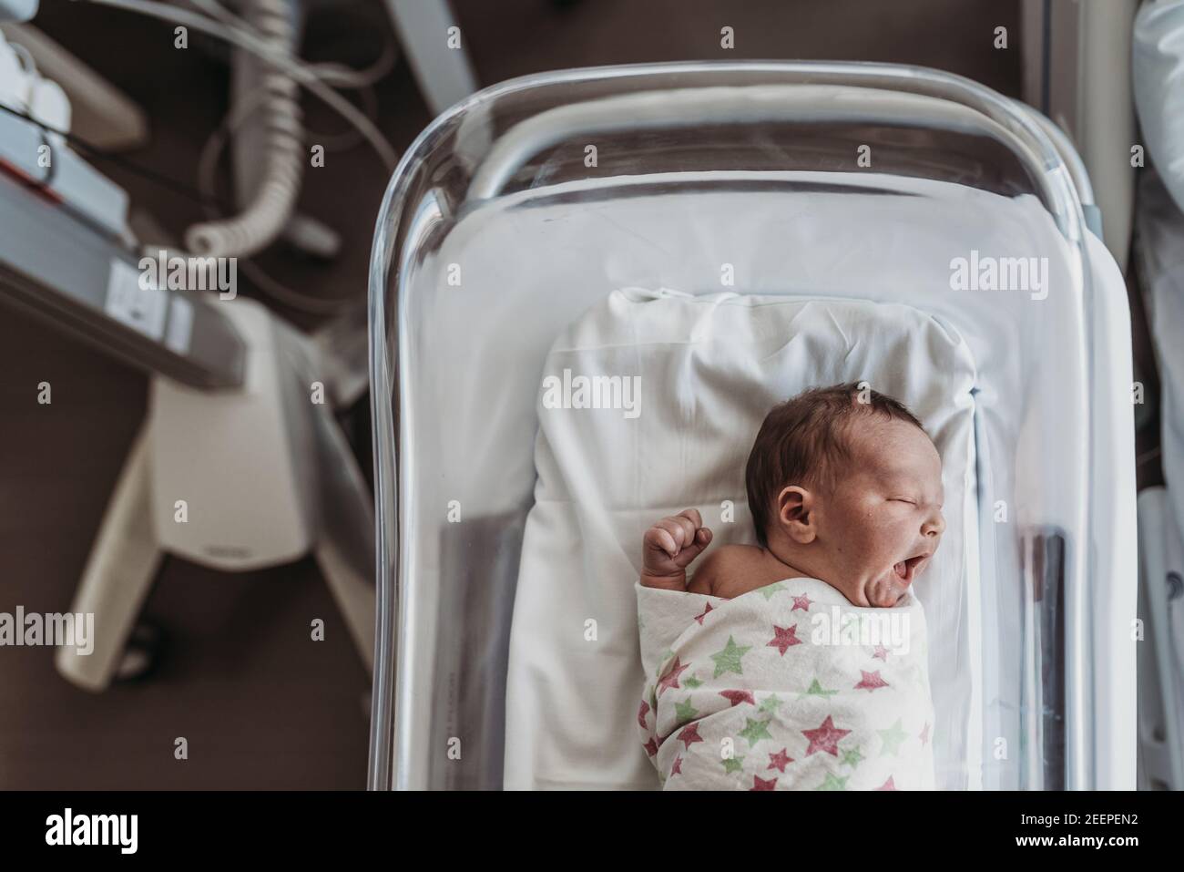Newborn baby boy in wrapped in hospital blanket Stock Photo