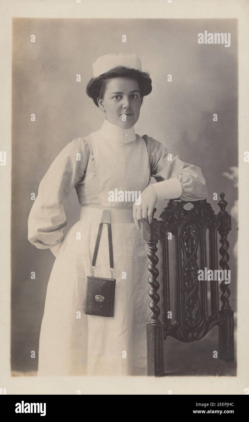 Vintage Early 20th Century London Photographic Postcard Showing a Female Nurse in Her Uniform. Stock Photo