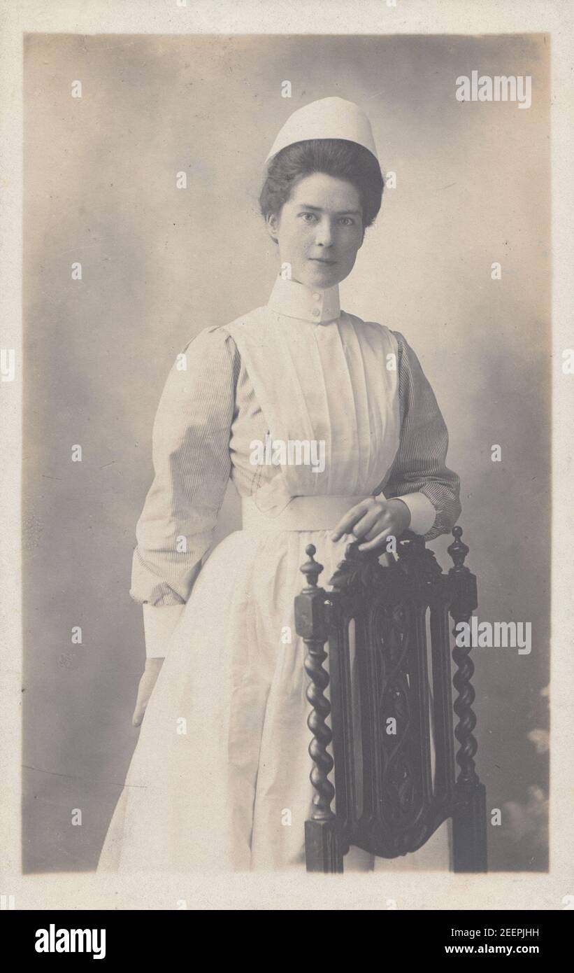 Vintage Early 20th Century London Photographic Postcard Showing a Female Nurse in Her Uniform. Stock Photo