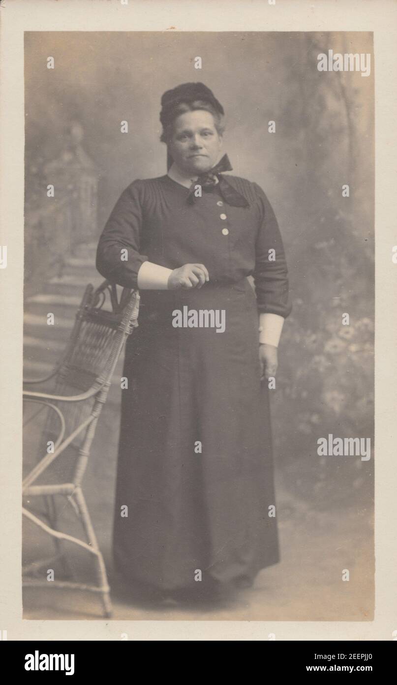 Vintage Early 20th Century Photographic Postcard Showing a Female Nurse? in Her Uniform. Stock Photo