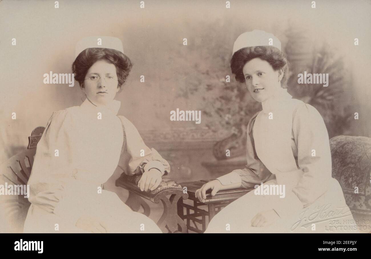 Vintage Early 20th Century London Photographic Postcard Showing Two Female Nurses in Their Uniforms. Stock Photo