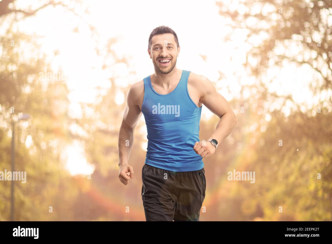 Young fit man running in a park Stock Photo
