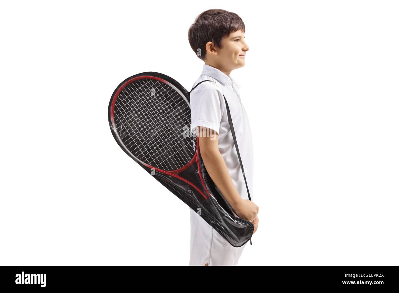 Boy carrying a tennis racket in a case isolated on white background