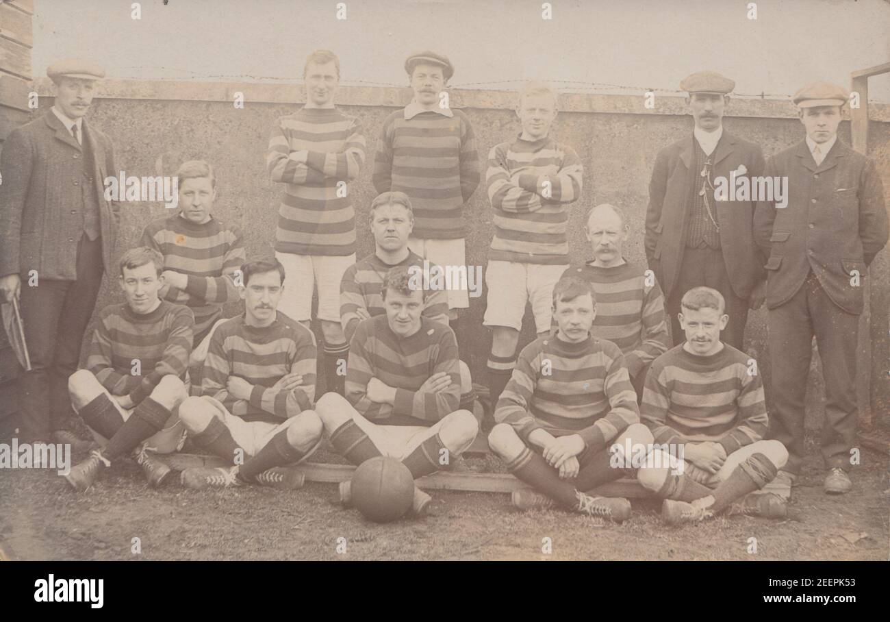 Vintage Early 20th Century Photographic Postcard Showing a Men's Football Team. Stock Photo