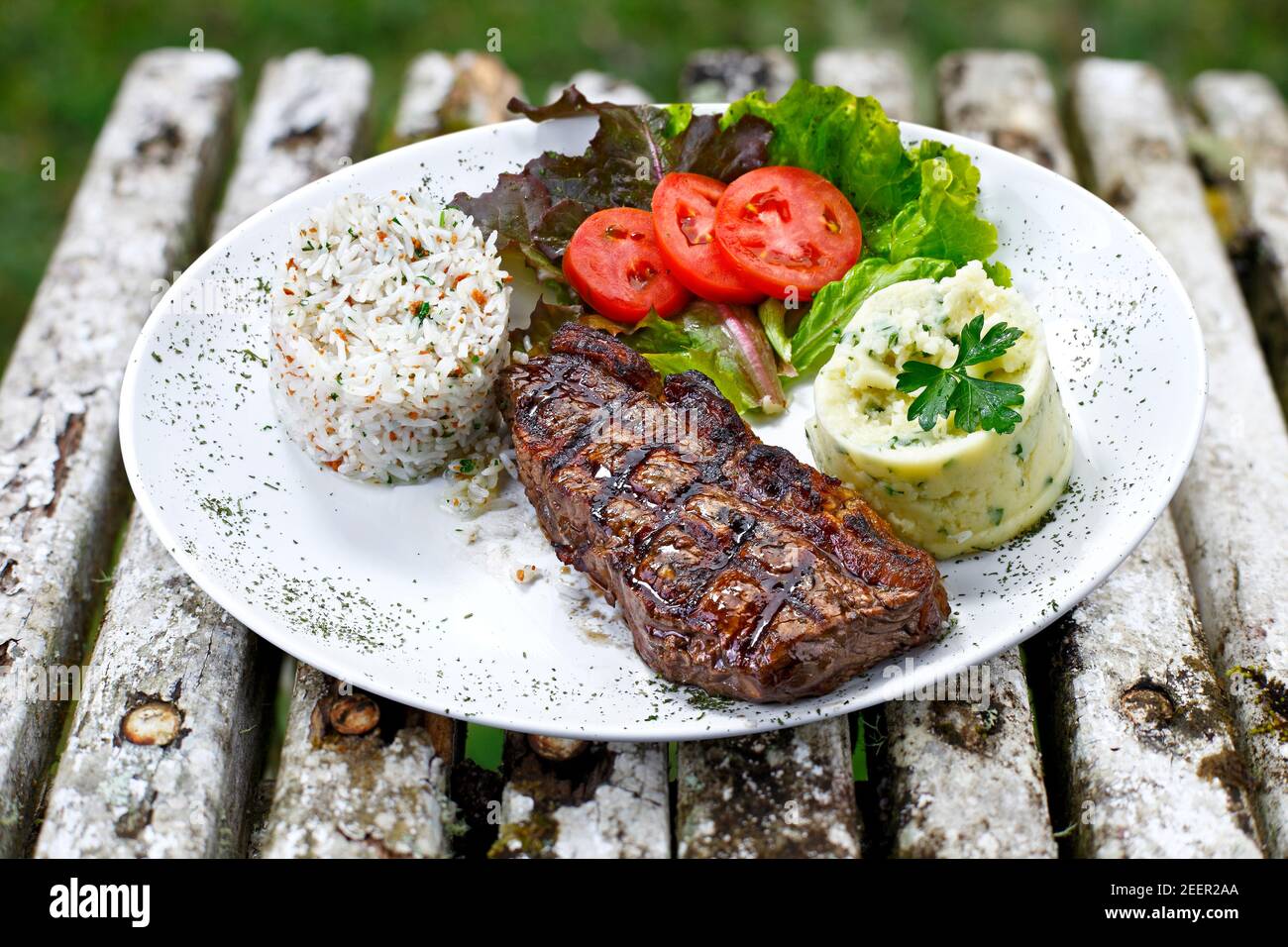Grilled meat with trimmings Stock Photo Alamy