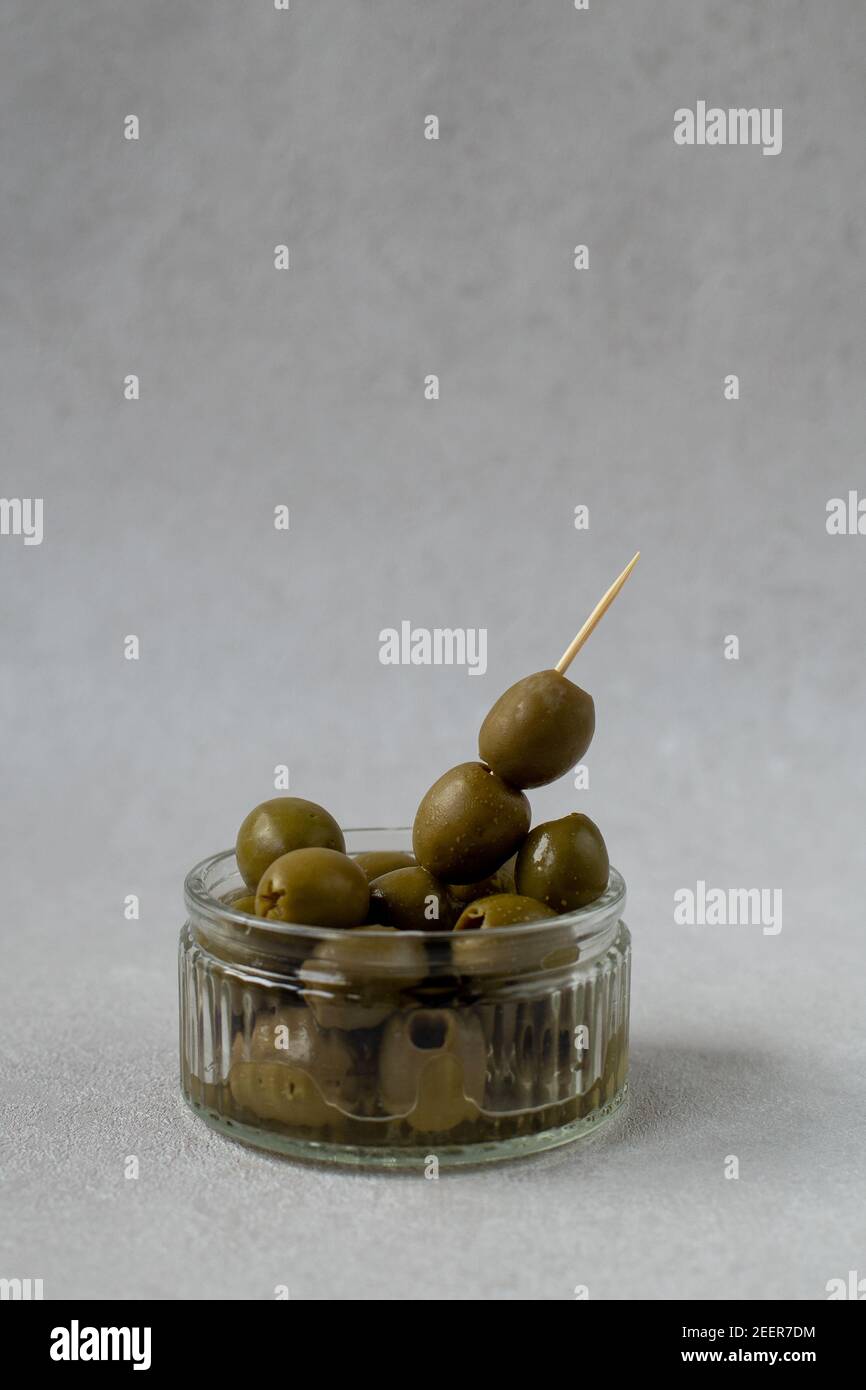 Styled olives with toothpick Stock Photo