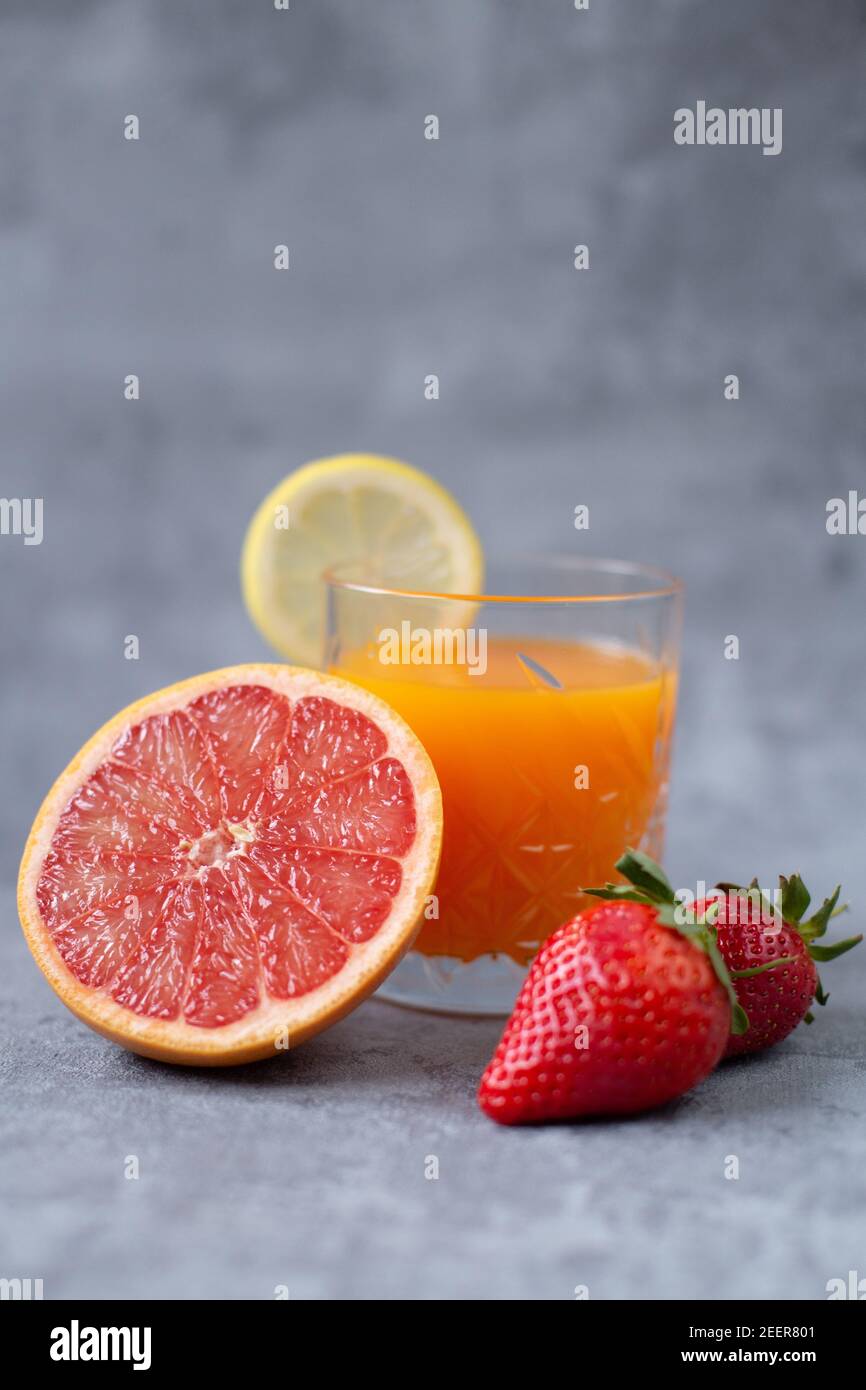 Fruit juice with strawberries, lemon and grapefruit Stock Photo Alamy
