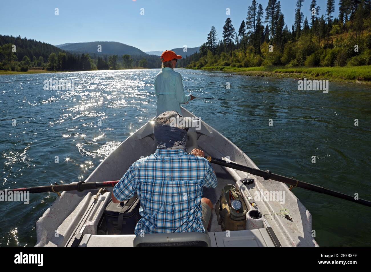 Tim and Joanne Linehan fly fishing the Kootenai River in summer. Lincoln County, northwest Montana. (Photo by Randy Beacham) Stock Photo