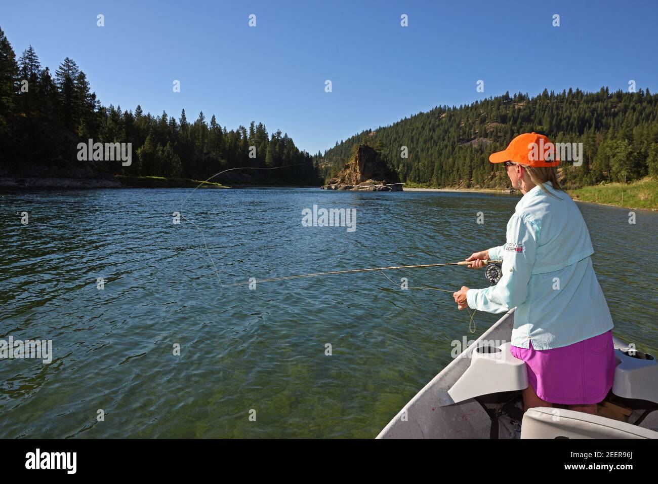 Joanne Linehan of Linehan fly fishing on the Kootenai River in summer. Lincoln County, northwest