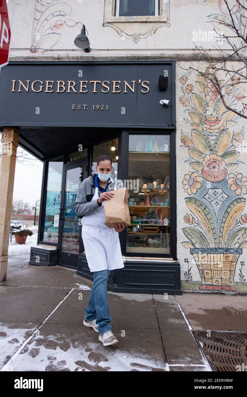 Curbside order with masked delivery of lutefisk from the Ingebretsen's Nordic Market Place during Covid Pandemic. Minneapolis Minnesota MN USA Stock Photo