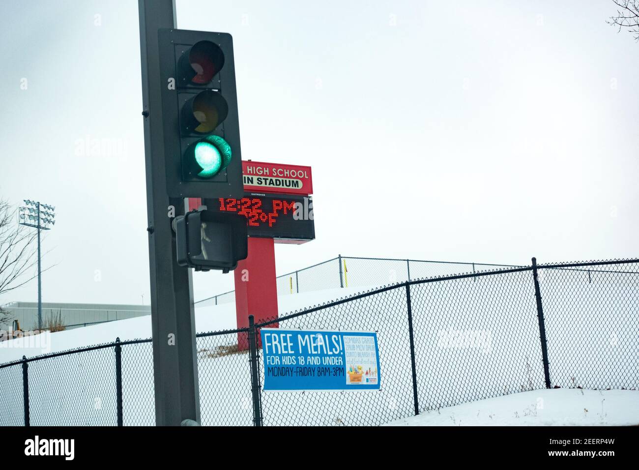 Sign on fence near semaphore advertising free meals for kids under 18 at Central High School. St Paul Minnesota MN USA Stock Photo