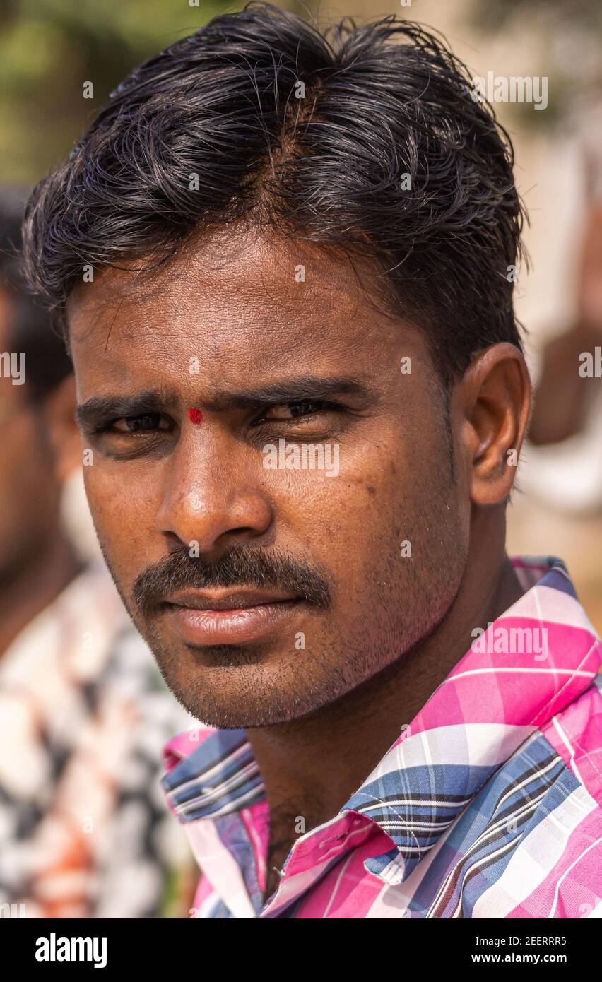 Ayodhya, Karnataka, India - November 9, 2013: Portrait of young farmer with  pink-white-blue shirt and black hair and mustache looking stern Stock Photo  - Alamy