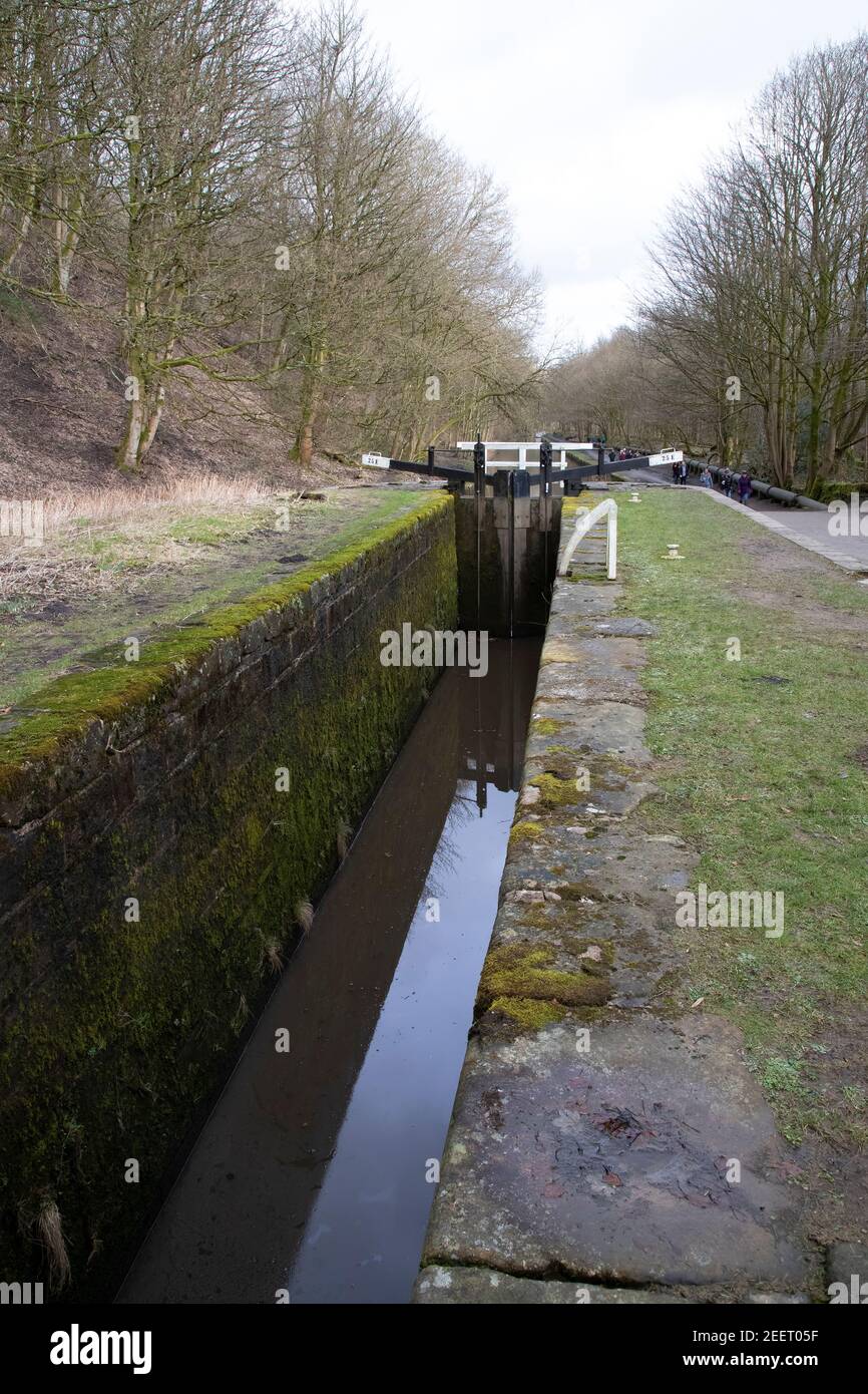 An empty canal lock on the Huddersfield Narrow Canal waterway west of Slaithwaite village in West Yorkshire Stock Photo