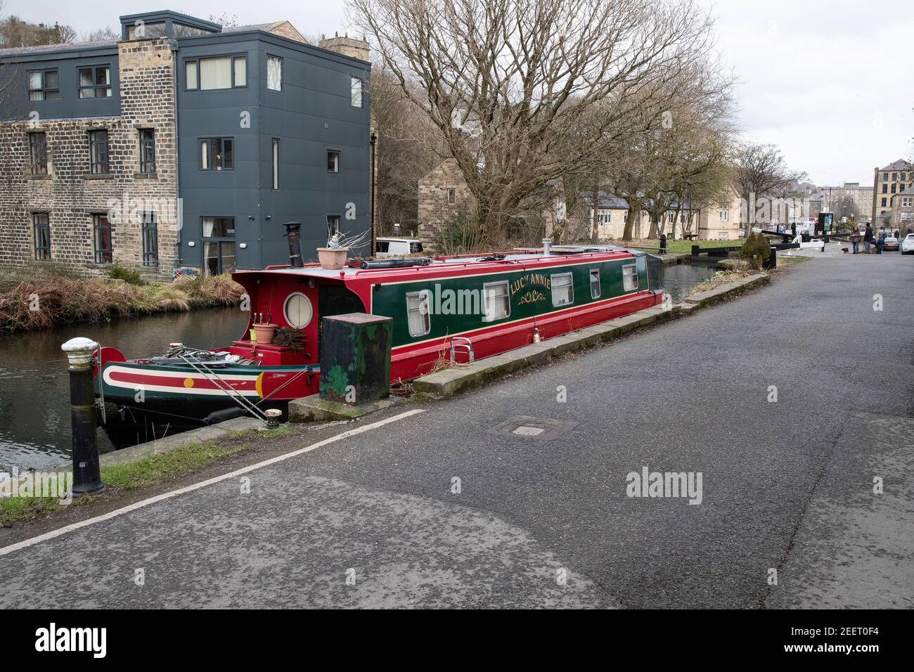 A smart well maintained narrow boat moored on the Huddersfield Narrow Canal at Uppermills in Slaithwaite Village, West Yorkshire U.K. Stock Photo