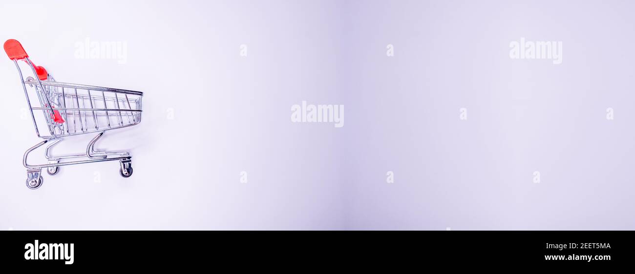 Side profile half turned close up view photo of tiny small silver and red metallic with wheels