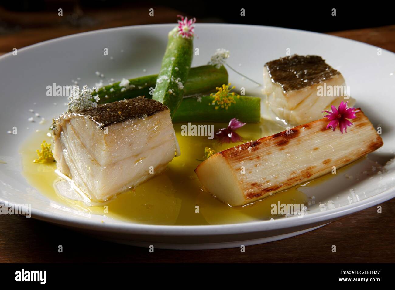 Baked cod with olive oil Stock Photo Alamy