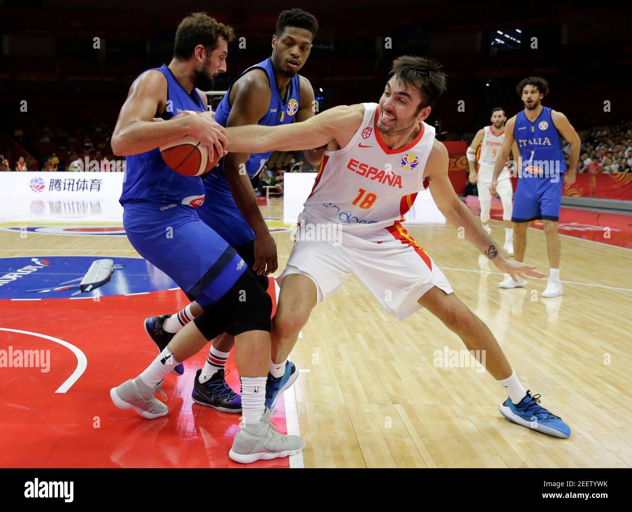 Basketball - FIBA World Cup - Second Round - Group J - Spain v Italy - Wuhan Sports Centre, Wuhan, China - September 6, 2019 Spain's Pierre Oriola in action with Italy's Marco Belinelli and Italy's Jeff Brooks REUTERS/Jason Lee Stock Photo