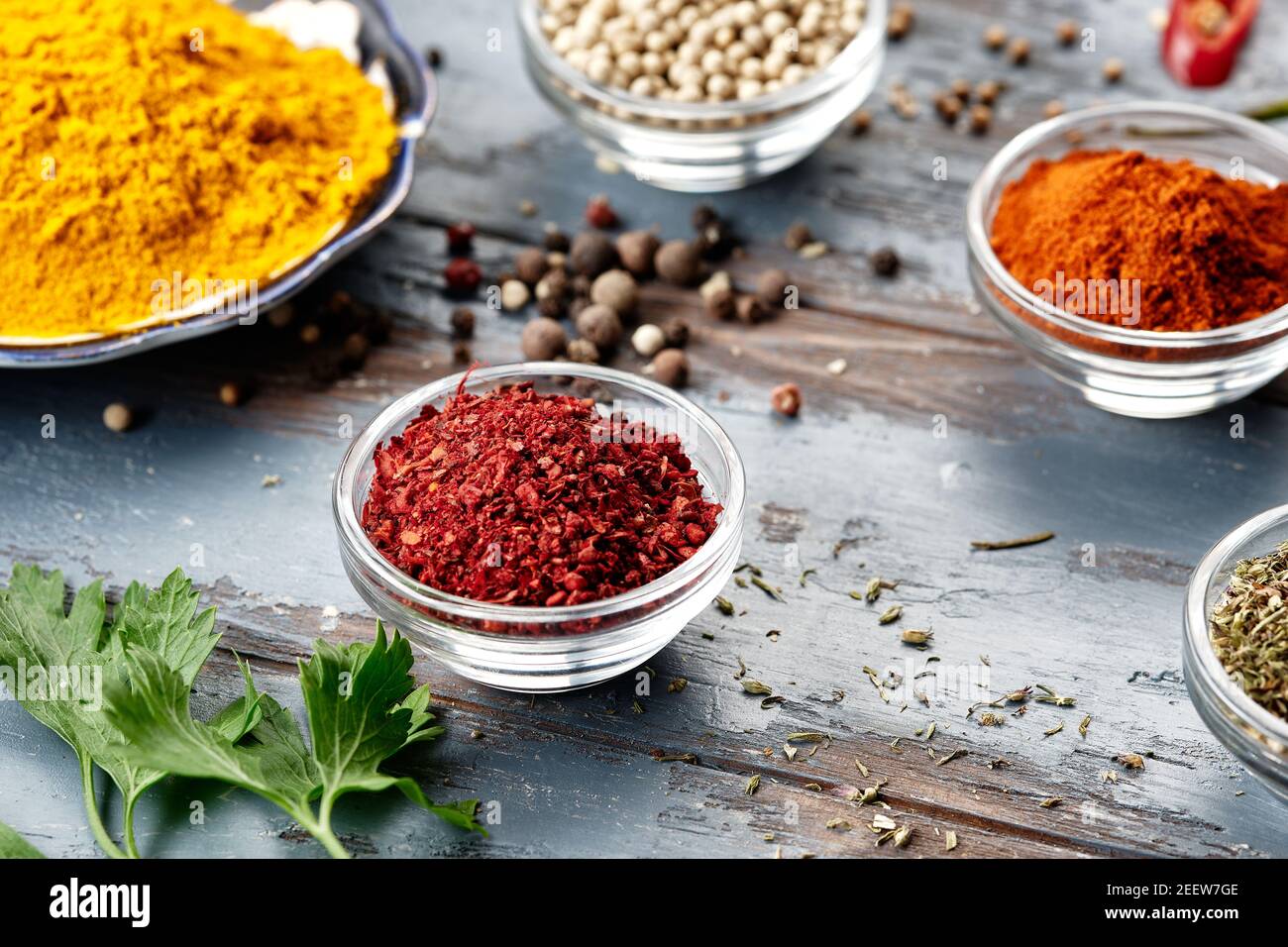 Various spices in bowls on grey table. Powdered spices Stock Photo - Alamy