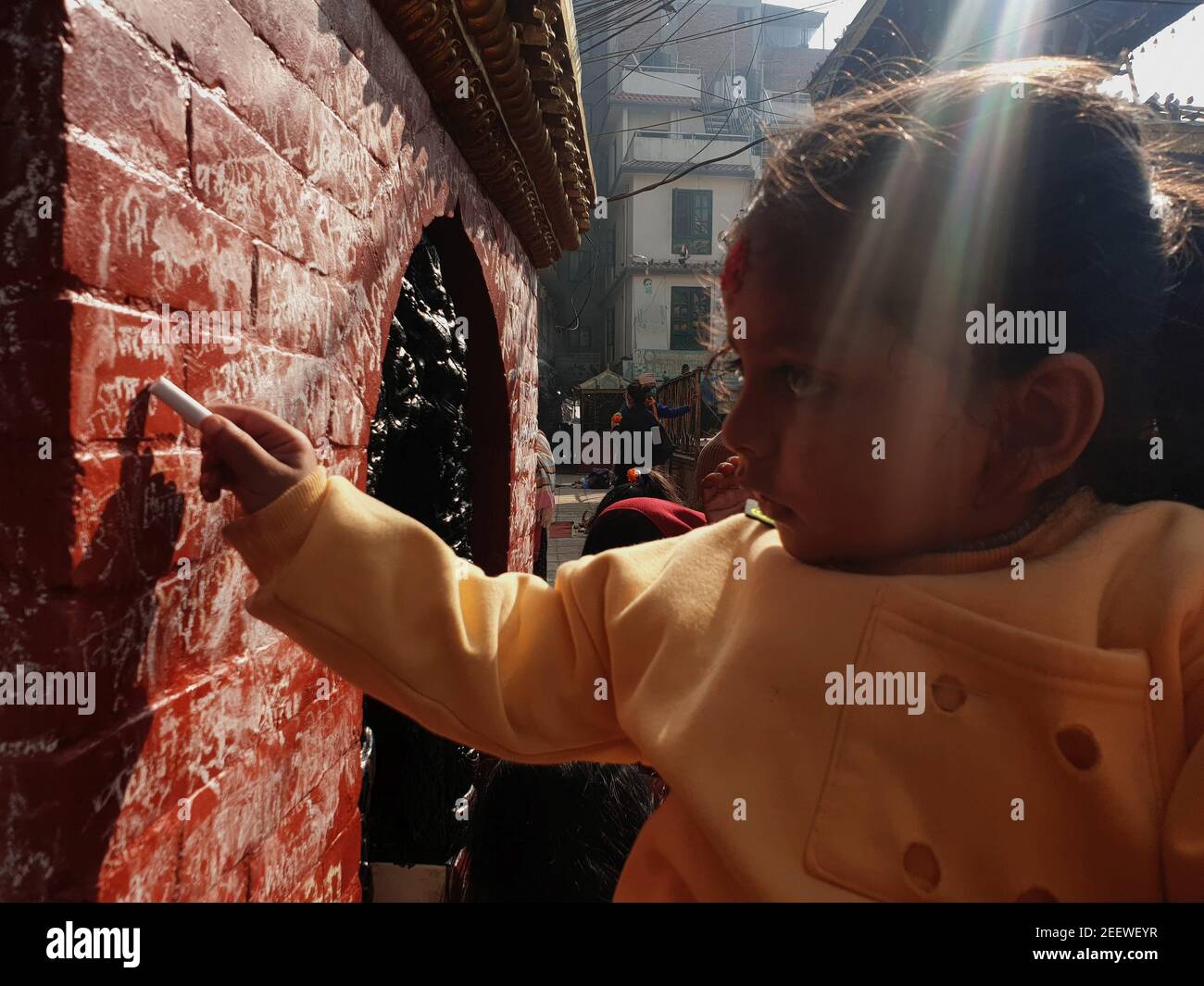 Kathmandu, Bagmati, Nepal. 16th Feb, 2021. A child writes with a chalk