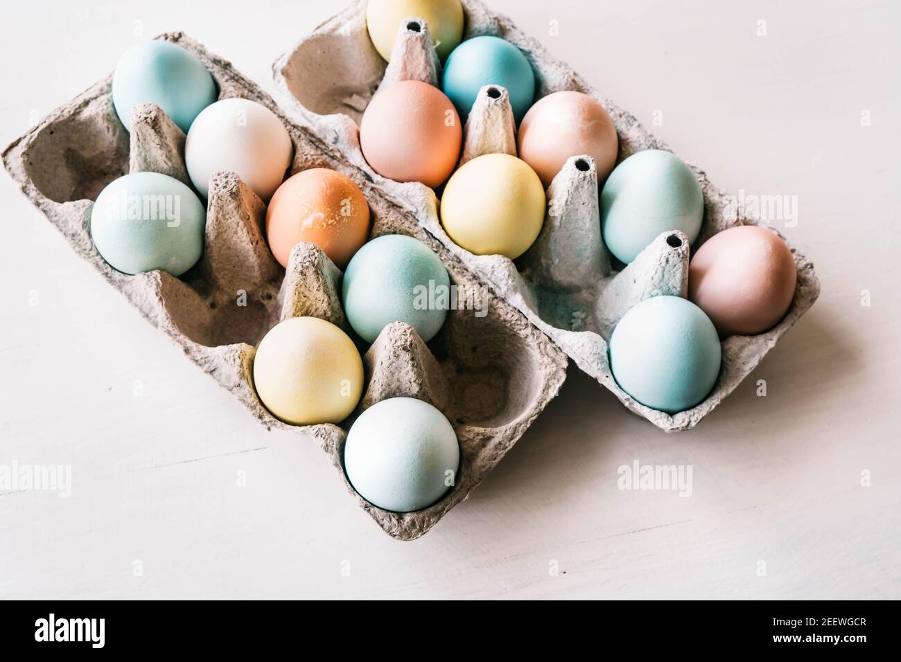 Easter Getting ready concept. Colored Easter eggs in two cartons. Stock Photo