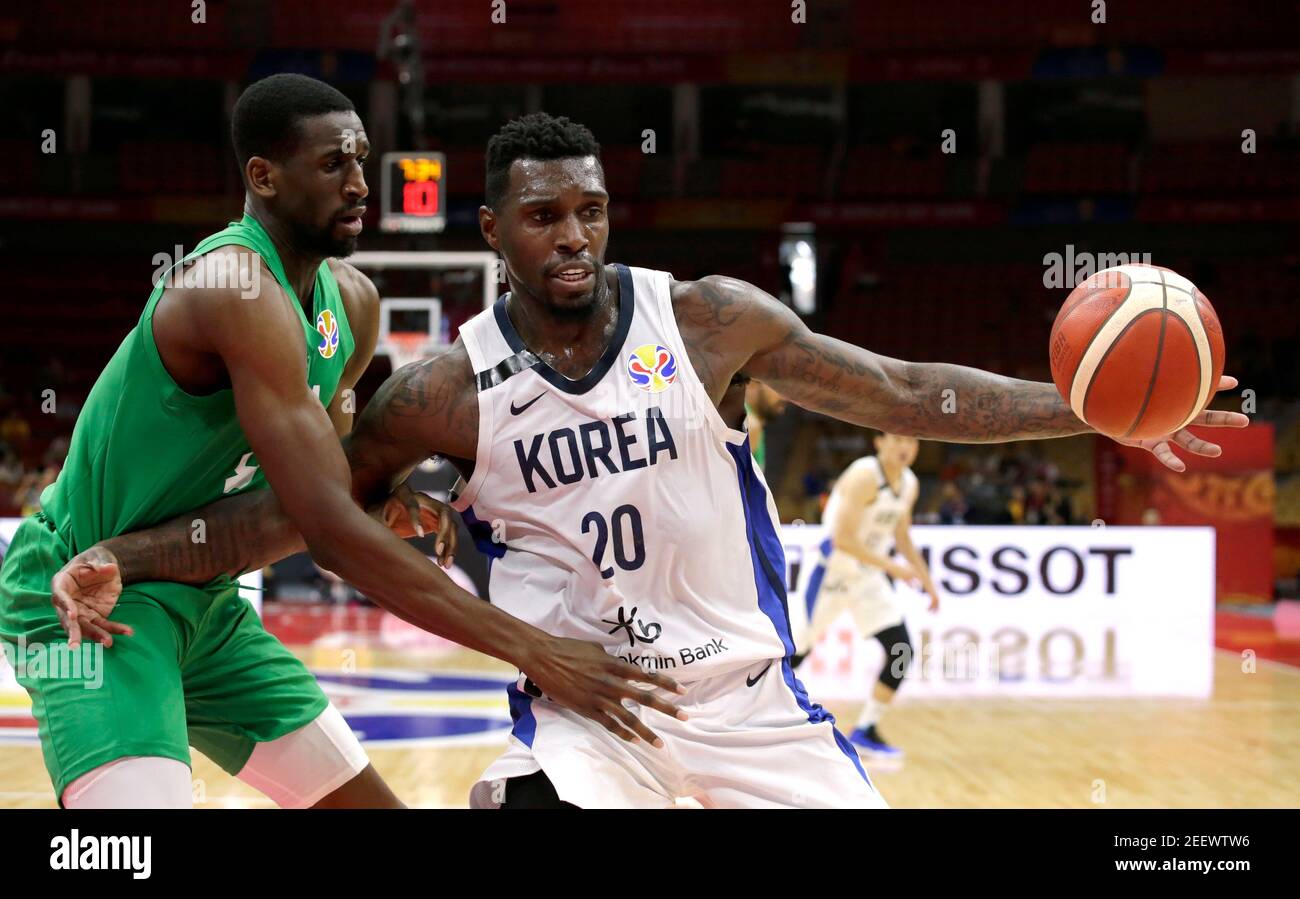 Basketball - FIBA World Cup - First Round - Group B - South Korea v Nigeria - Wuhan Sports Centre, Wuhan, China - September 4, 2019. South Korea's Guna Ra in action with Nigeria's Ekpe Udoh. REUTERS/Jason Lee Stock Photo