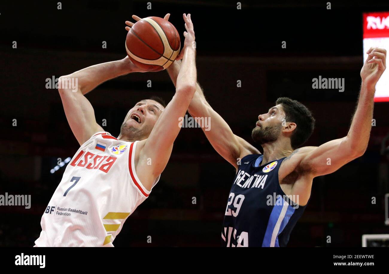 Basketball - FIBA World Cup - First Round - Group B - Russia v Argentina - Wuhan Sports Centre, Wuhan, China - September 4, 2019  Russia's Vitaly Fridzon in action with Argentina's Patricio Garino REUTERS/Jason Lee Stock Photo