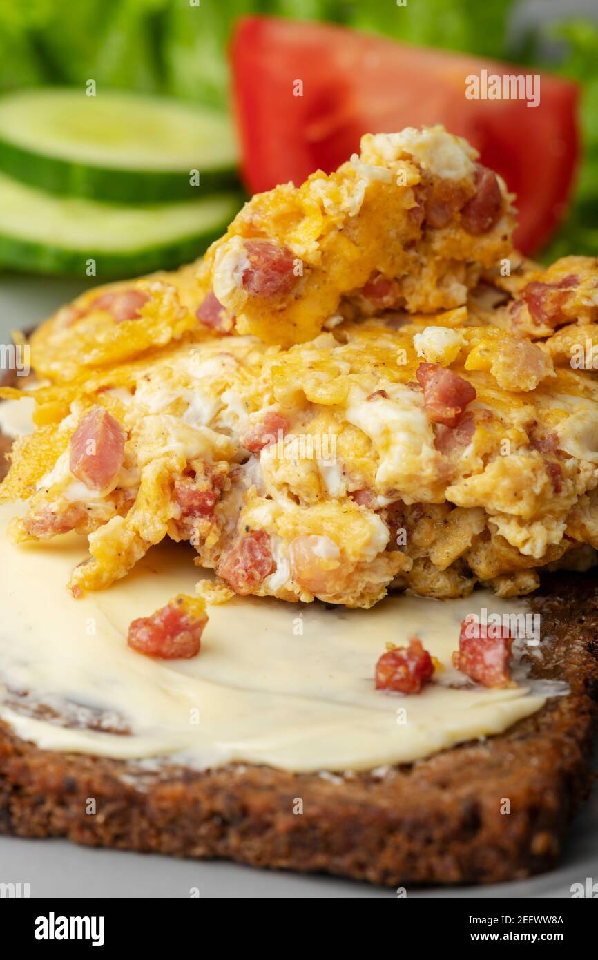 scrambled eggs on a rye bread Stock Photo