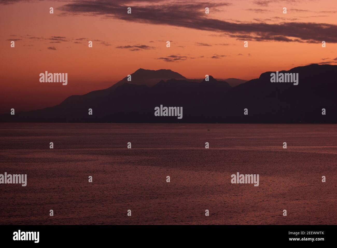 Landscape of mountains with red sunset sky background Stock Photo - Alamy