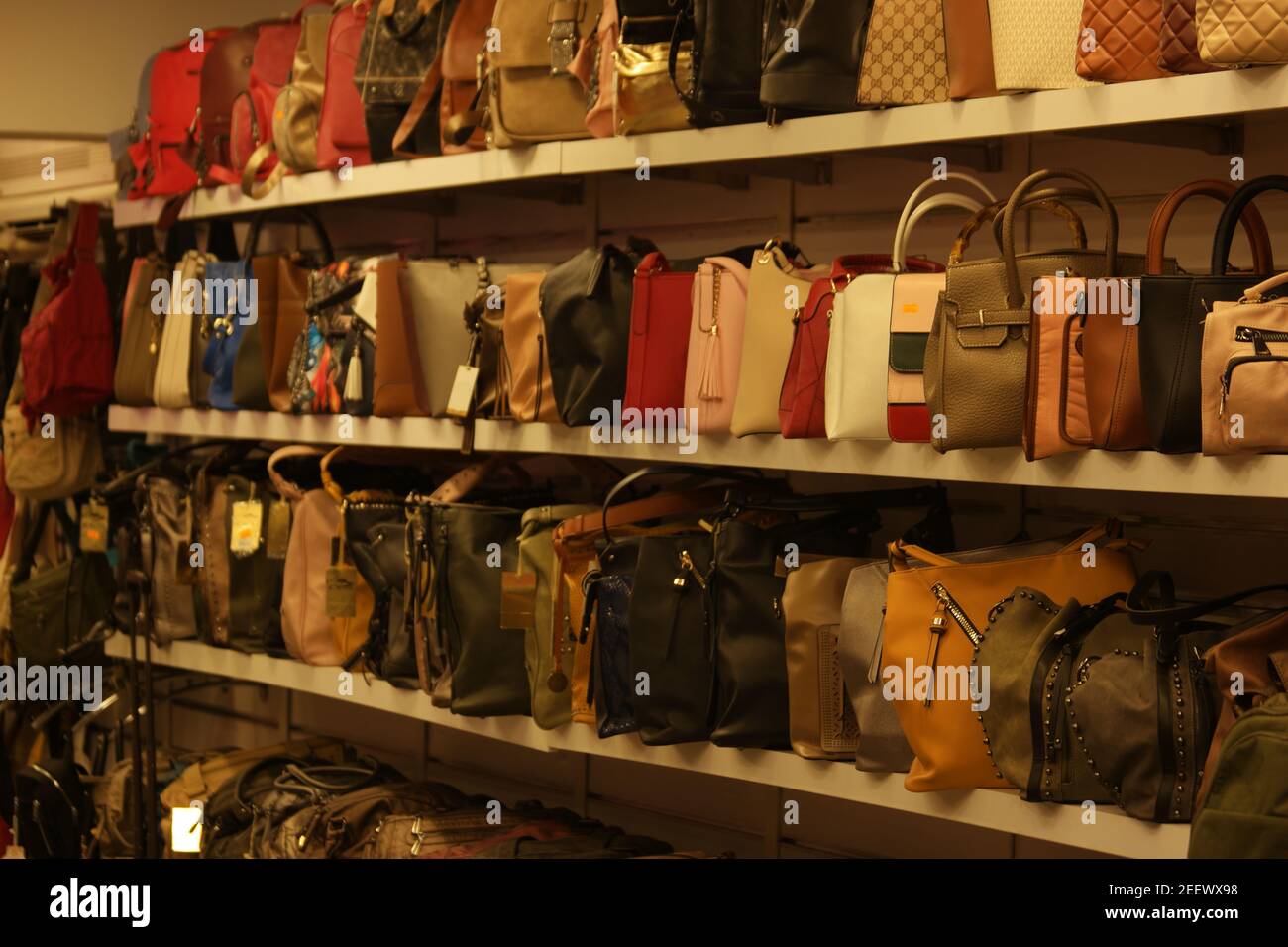 Collection of handbags on display at shopping center Stock Photo