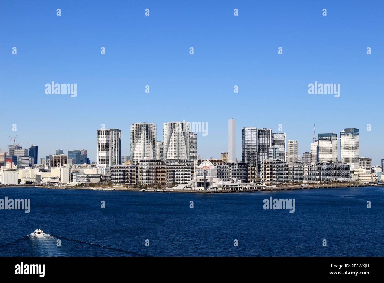 A view of the apartment houses in the bay area lined up from Harumi to Kachidoki, which can be seen from the Rainbow Bridge in Tokyo Bay Stock Photo