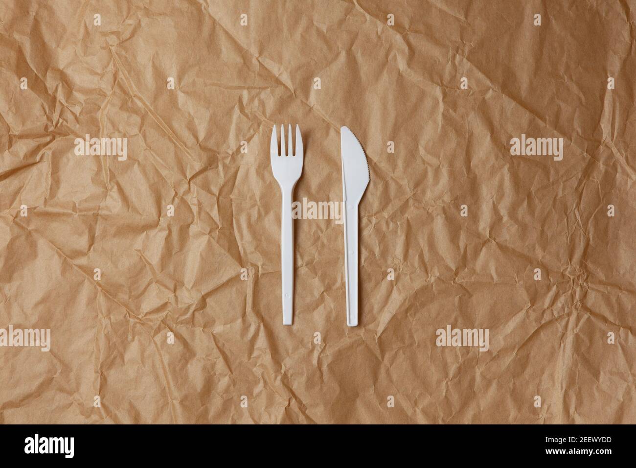 Reusable recyclable white fork, knife made from corn or oats starch on