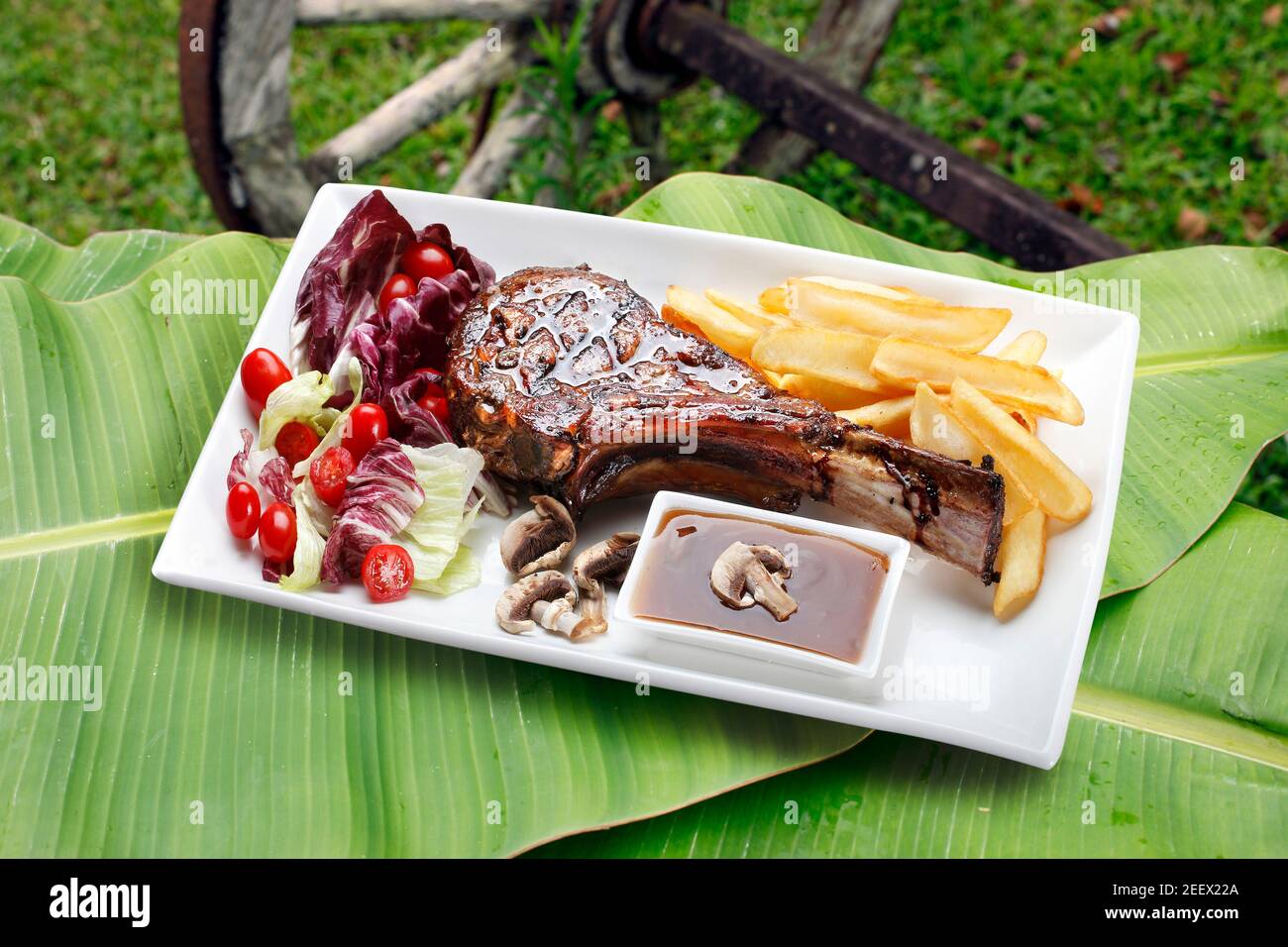 Prime rib with fries and salad Stock Photo - Alamy